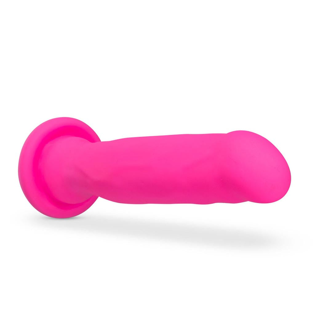 blush novelties impressions havana pink vibrating dildo on it's side